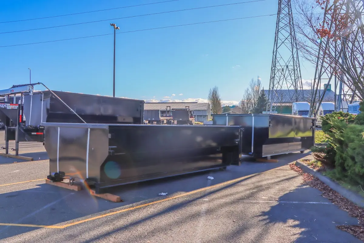 Roll-off dumpster ready for waste disposal at job site for Demolition Dumpster Rental in Brunswick